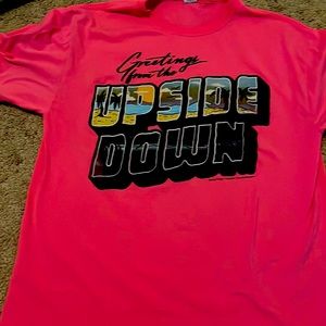 Bright pink stranger Things shirt